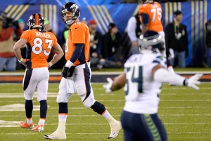 Peyton Manning looks despondent on the field at MetLife Stadium. From blogs.denverpost.com/